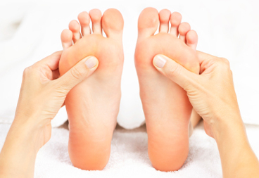 Foot Massage eg feet receive reflexology foot massage